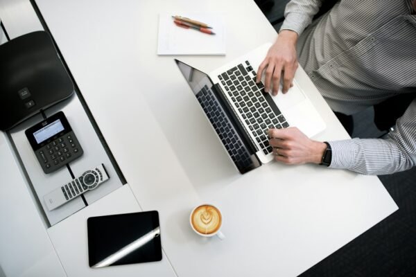 Small business owner using AI software on a laptop